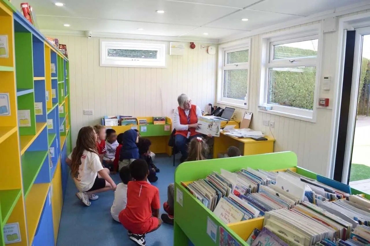 modular library building on the playground for easy access to reading for all pupils