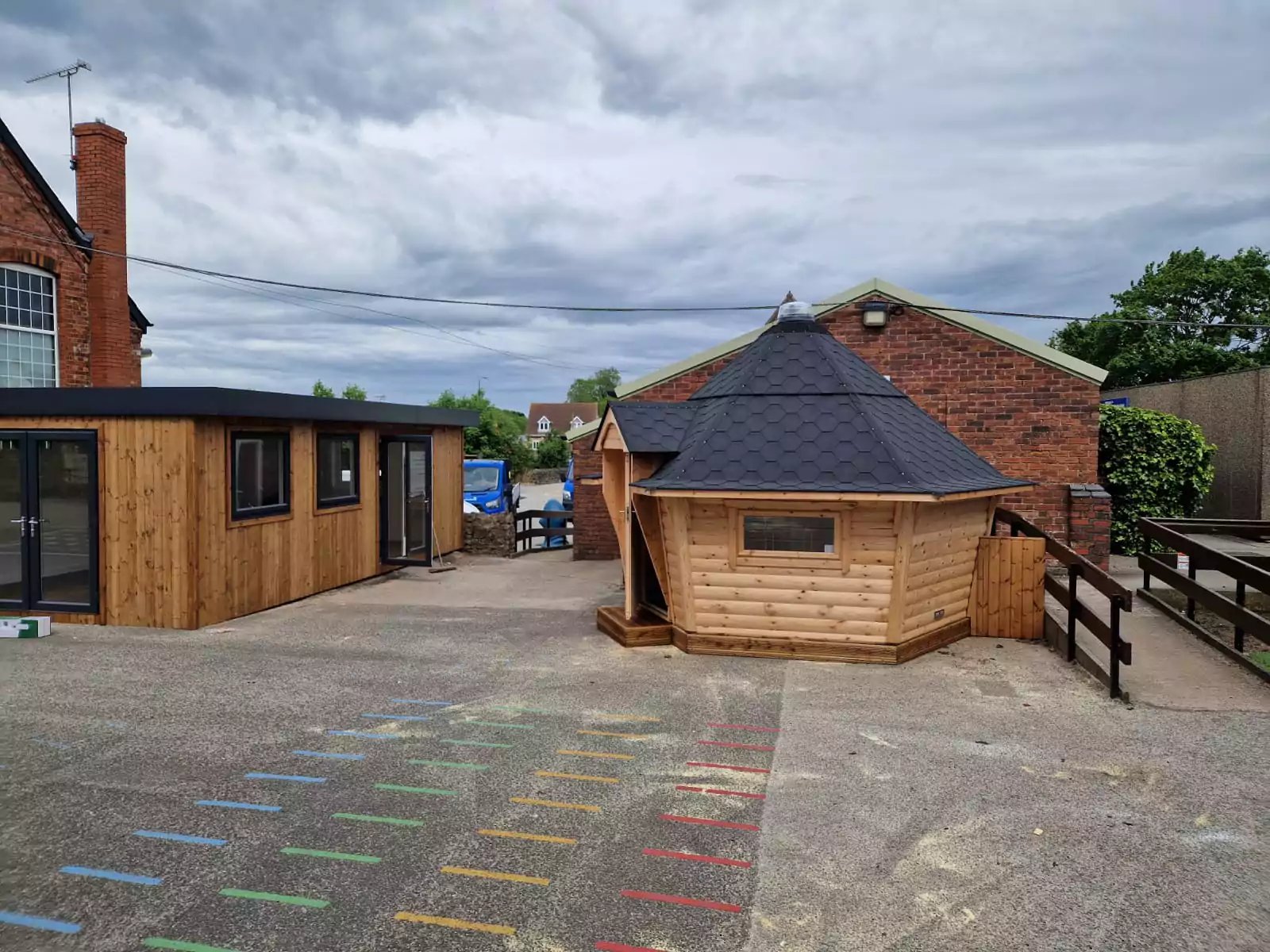 extra classroom and a log cabin on playground 