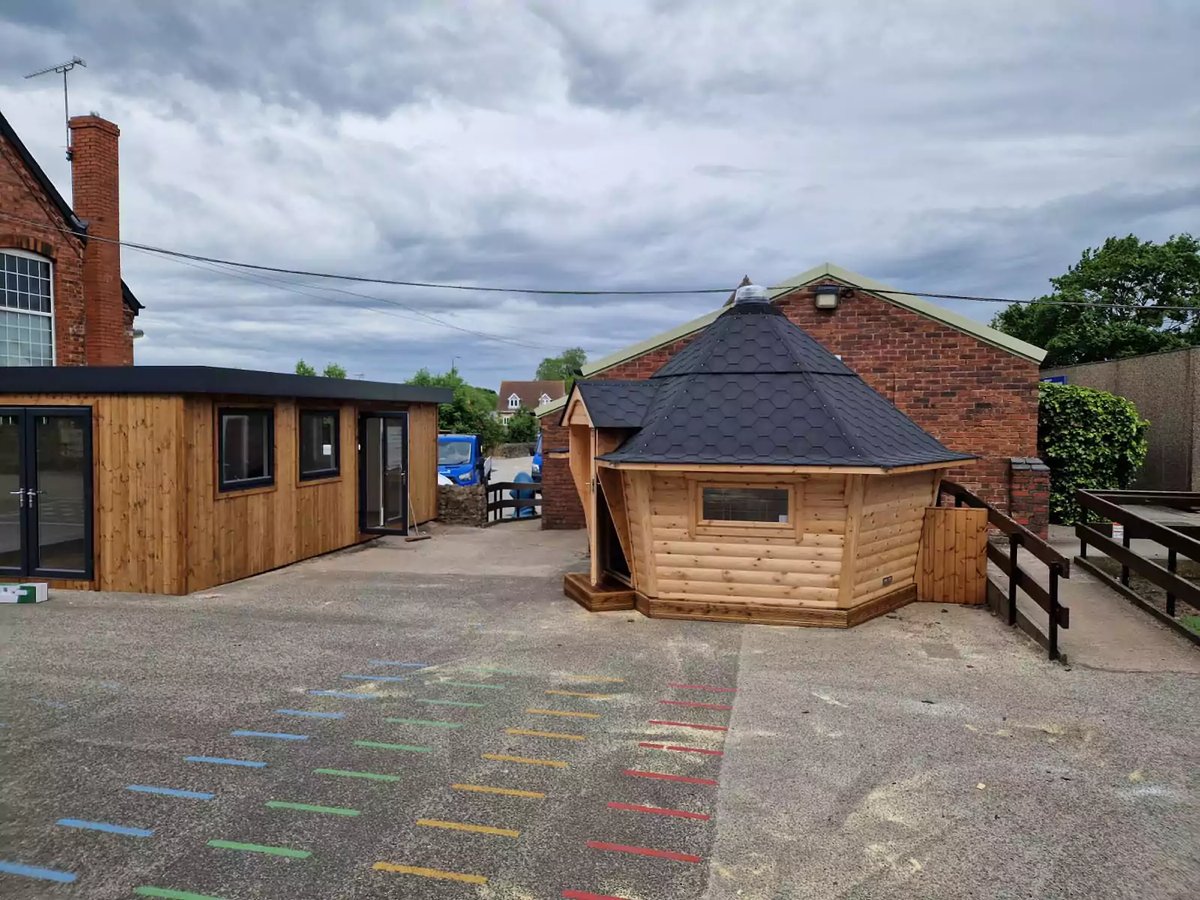 extra classroom and a log cabin on playground 