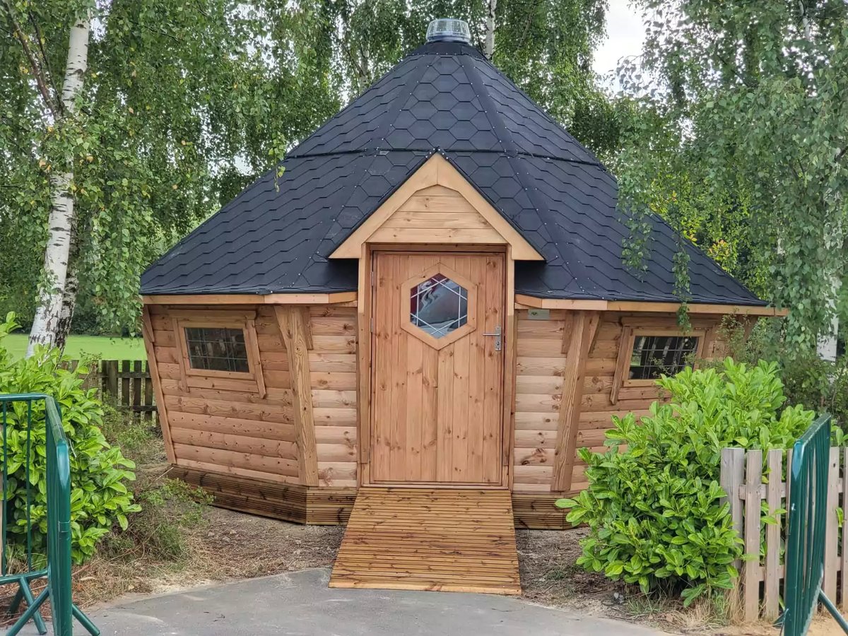 accessible forest learning log cabin with a ramp for wheelchair users 