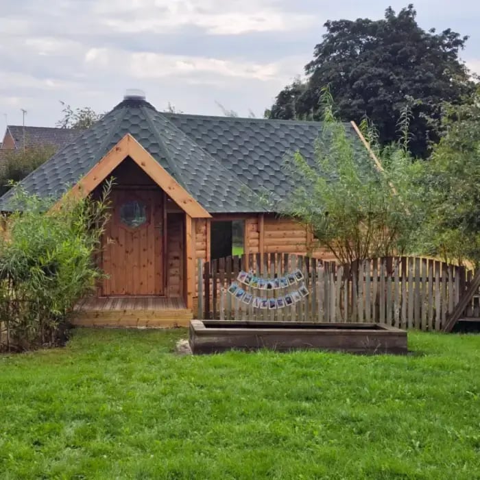 log cabin wraparound care outdoor space