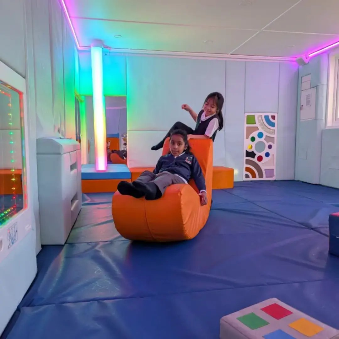 students regulating their emotions in their sensory room