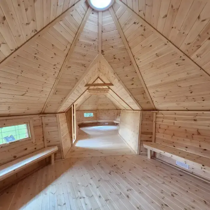 Eco-friendly Forest School cabins for UK schools – durable timber structures with solar domes and sheltered porches, perfect for outdoor learning in any weather.