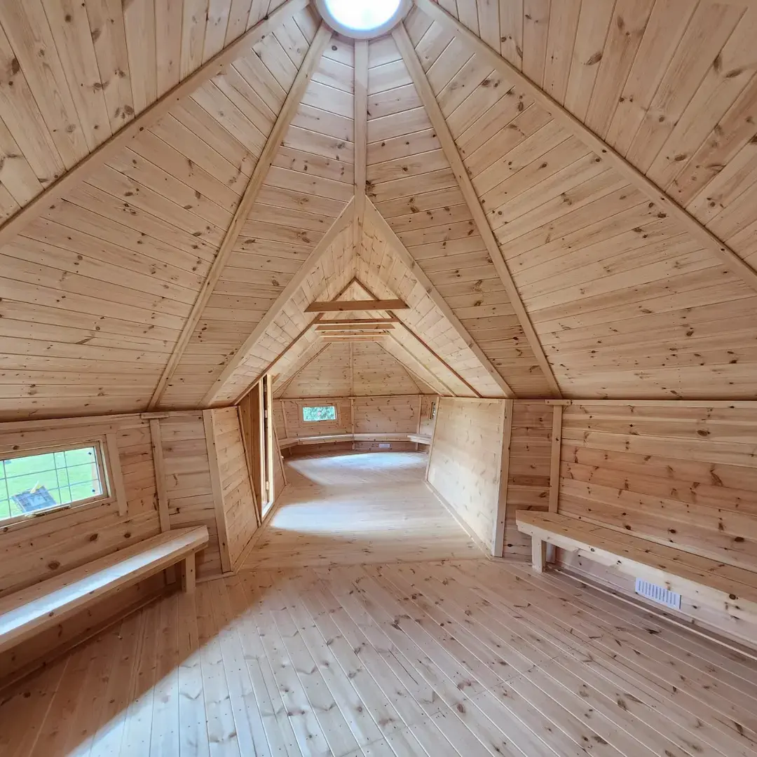 Eco-friendly Forest School cabins for UK schools – durable timber structures with solar domes and sheltered porches, perfect for outdoor learning in any weather.