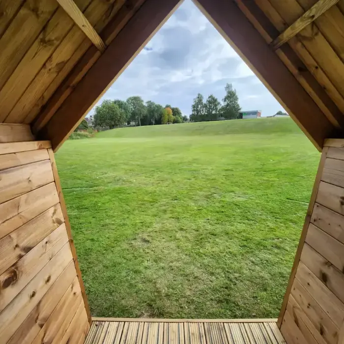 Eco-friendly Forest School cabins for UK schools – durable timber structures with solar domes and sheltered porches, perfect for outdoor learning in any weather.