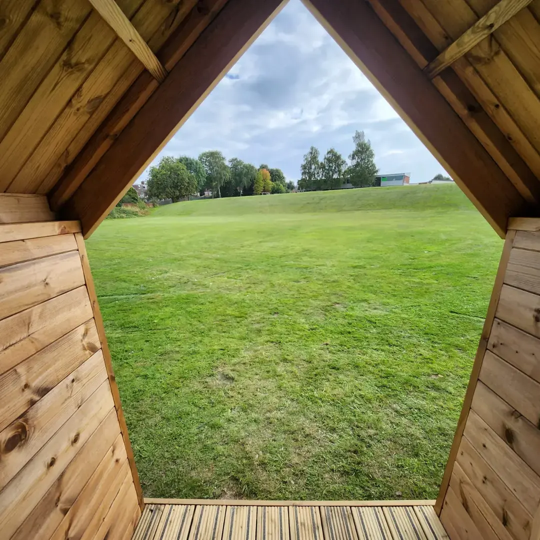 Eco-friendly Forest School cabins for UK schools – durable timber structures with solar domes and sheltered porches, perfect for outdoor learning in any weather.