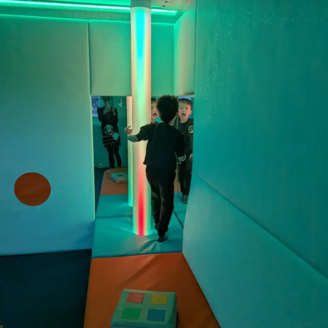 child enjoying sensory light tube